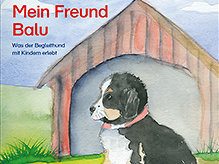 Am Cover ist ein schwarz-weißer Hund vor einer Hundehütte sowie der Text "Mein Freund Balu - Was der Begleithund mit Kindern erlebt" zu sehen.