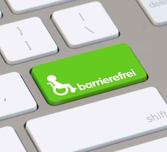 Barrierefrei surfen im WorldWideWeb. Weiße Tastatur mit einem grünen Taststein, daraut ein Rollstuhl mit einer Person und das Wort "barrierefrei"