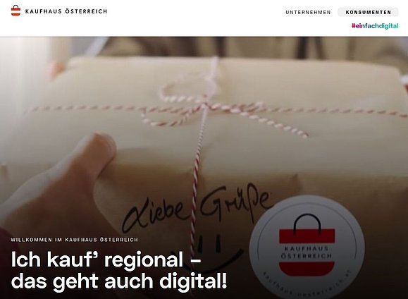 Links oben ist das Logo zu sehen, rechts ein Umschalter zwischen Unternehmen und Konsumenten und mittig ein Slider mit einem Paket und einem Text "Willkommen im Kaufhaus Österreich - Ich kauf' regional - das geht auch digital!".